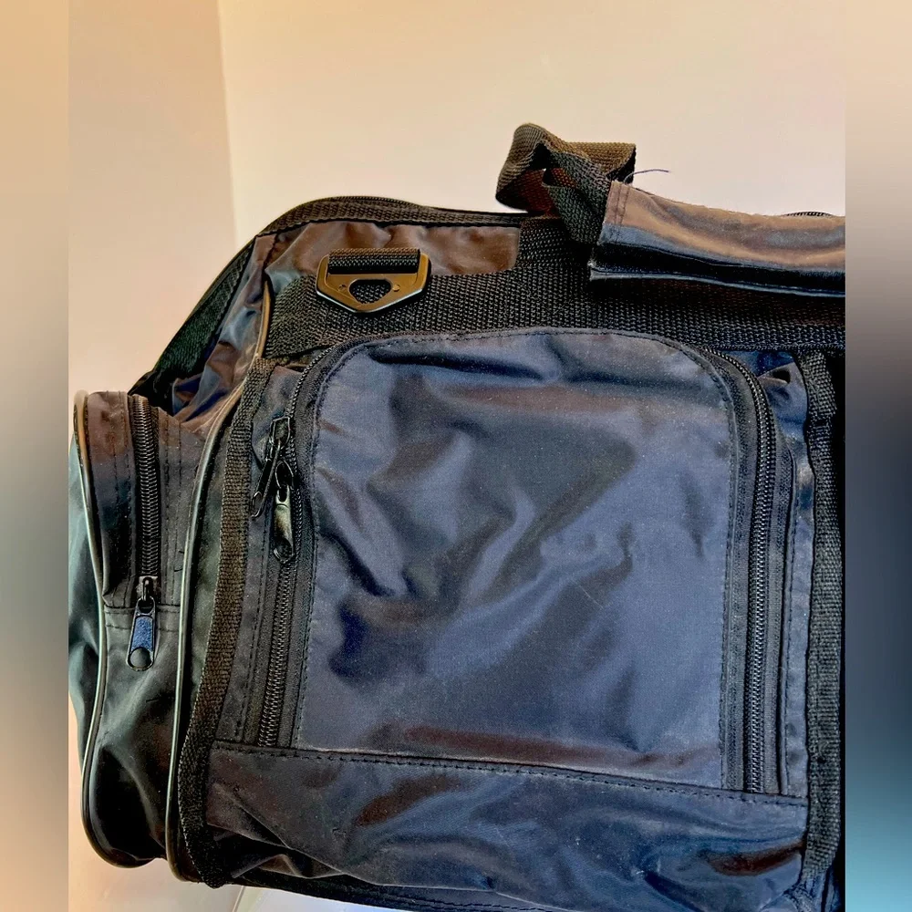 Stylish Vintage Dark Black Duffel Bag with Many Pockets. New without Tags.